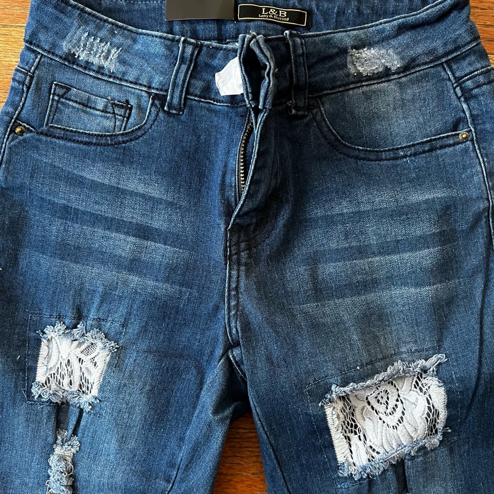 L & B Lace patch jeans. Size 2. Straight leg. Mid rise waist